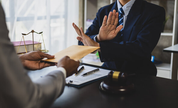 Attorney adjudicating bribery cases, Businessman trying to bribe a lawyer.