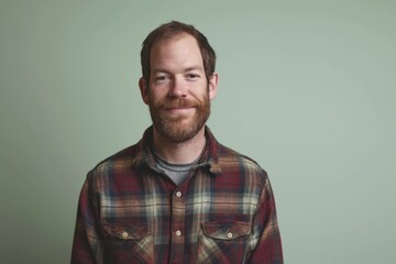 Portrait of a red-bearded man in a plaid shirt