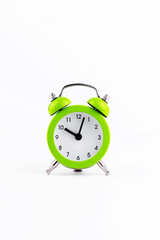 Green The clock sets the time to 10.00. on white background isolate.