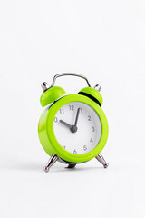 Green The clock sets the time to 10.00. on white background isolate.