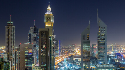 Skyline view of the buildings of Sheikh Zayed Road and DIFC night timelapse in Dubai, UAE.