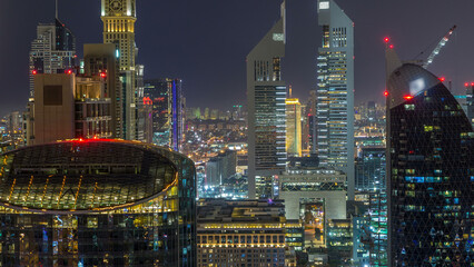Fototapeta na wymiar Skyline view of the buildings of Sheikh Zayed Road and DIFC night timelapse in Dubai, UAE.