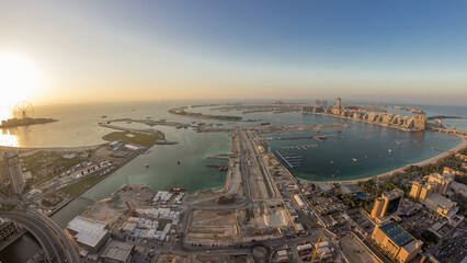 Aerial sunset view of Palm Jumeirah Island day to night timelapse.