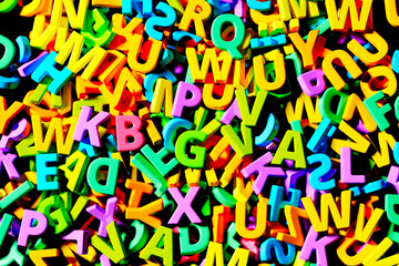 Vibrant and Colorful Assortment of Scattered 3D Alphabet Letters on Floor