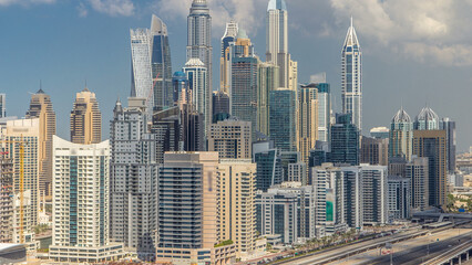 Fototapeta na wymiar Dubai Marina skyscrapers aerial top view with clouds from JLT in Dubai timelapse, UAE.
