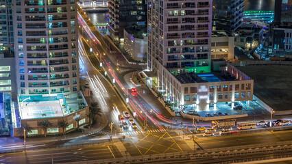 Fototapeta na wymiar Aerial view of a road intersection in a big city night timelapse.