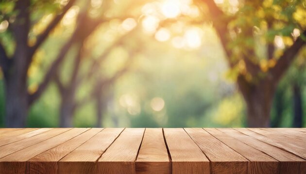 empty wooden table over blurred green nature park background product display empty wood table and defocused bokeh and blur background of garden trees with sunlight product display template