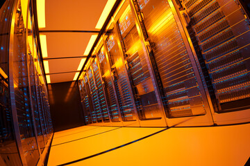 Vibrant Orange-Lit Data Center Server Room Showcasing Advanced Network Racks - 767140179