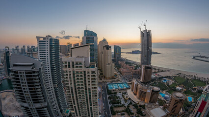 JBR and Dubai marina after sunset aerial day to night timelapse