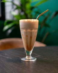 Cold beverage made out of coffee and milk from proffesional brewer of a coffee shop