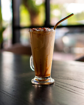 Cold beverage made out of coffee and milk from proffesional brewer of a coffee shop