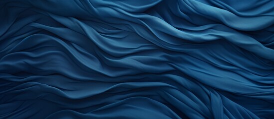 A close up of a fluid, electric blue silk cloth with a mesmerizing wind wave pattern, resembling the fluidity and movement of water