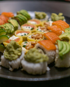 Delicious gourmet Sushi in a black table with black plates