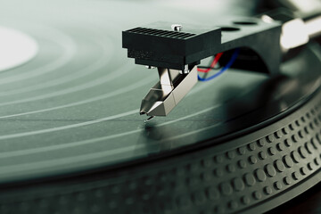Detailed Close-Up of Needle on Vintage Vinyl Record on Turntable in Action