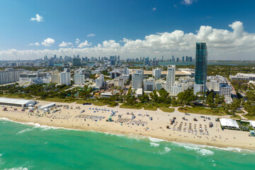 Popular vacation spot in the United States. Ocean warm waters and sandy beachfront at Miami Beach...