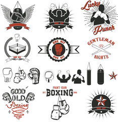 Naklejka premium Set of the boxing club labels, emblems and design elements. Design elements for logo, label, emblem, insignia, sign, identity, logotype, poster. Boxing club