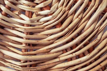 Texture of a wicker basket made of willow branches close-up. Abstract background
