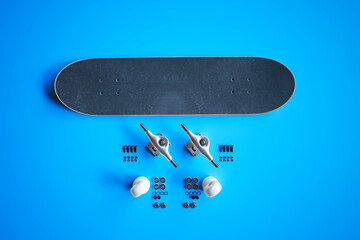 Comprehensive Disassembly of Skateboard Components on a Stunning Blue Background