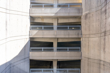 Fototapeta premium Elevation view of a multi level concrete parking garage, car park, during the day.