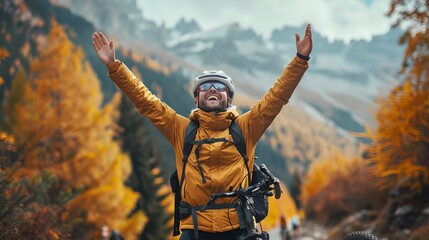 Ecstatic male tourist celebrating his outdoor adventure on a mountainside trail in the fall season - obrazy, fototapety, plakaty