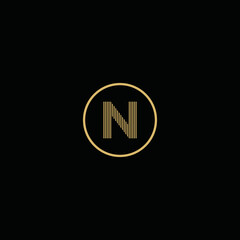 Simple gold letter N logo, with circles and black background