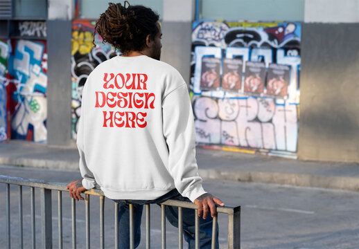 Mockup of man wearing customized sweatshirt on railings