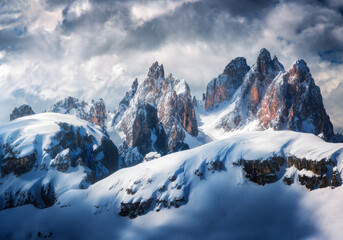 Beautiful mountain peaks in snow in winter. Dramatic landscape