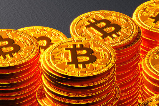 Close-Up of Golden Bitcoins Stacked Against a Textured Surface