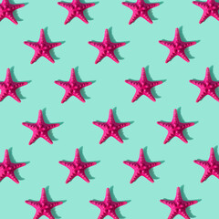 Fototapeta na wymiar Summer pattern made with starfish on bright light background. Minimal trendy summer concept.