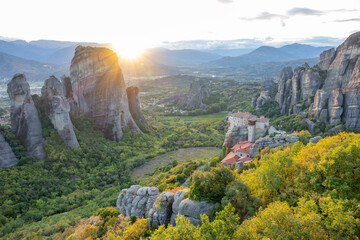 Sunset Rays over a Valley with a Greek Rock Monastery