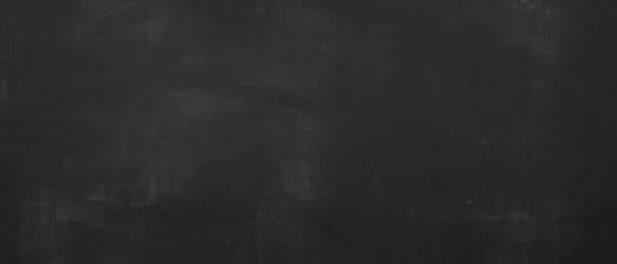 Foto auf Acrylglas Black scratched anthracite blackboard chalkboard with chalk, concrete wall texture background, education backdrop © Corri Seizinger