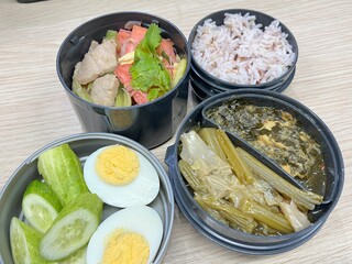 Boiled vegetables, Stir-fried pink noodles with tofu, boiled eggs, and brown rice
