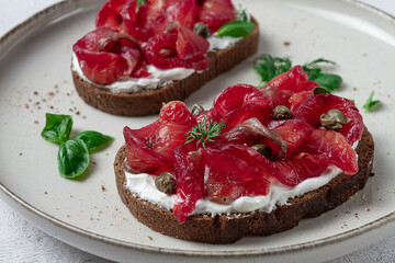 Sandwiches with gravlax salmon, cream cheese, capers, greens, breakfast, homemade,