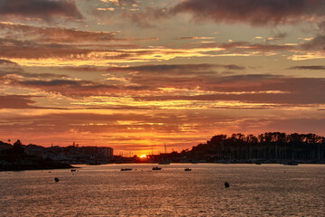 Spectacular reddish sunset at Ladeira Beach, Baiona, Pontevedra, Spain