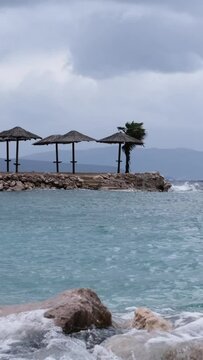 Beautiful cinematic water splashes. Powerful waves crashing the coast of Njivice, Croatia one day after Storm Ciar&aacute;n smashed into Krk Island. Birds flying above the disquiet sea surface.