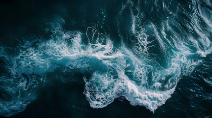 A large wave crashing into the shore. The water is white and frothy, and the wave is high and powerful. Scene is intense and dramatic, as the wave seems to be in full force - obrazy, fototapety, plakaty