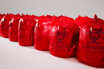Sealed Red Biohazard Bags Lined Up for Infectious Waste Disposal - 767202352