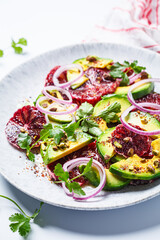 Blood oranges salad with avocado, pistachios and red onions.