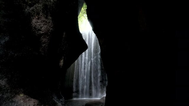 Tripod footage of Tukad Cepung waterfall (one of the most popular on the island). Bali, Indonesia.