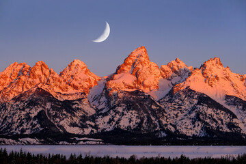 Sunrise on Teton Mountain Range in Wyoming Alpen Glow Orange and Pink on Rugged Mountains with...