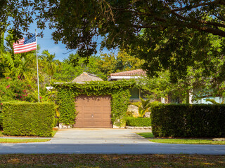 Driveway with American flag on house gate
