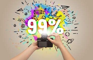 Close-up of a hand holding digital camera with abstract drawing