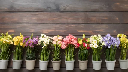 Foto op Plexiglas Spring flowers in pots arranged neatly on wooden background © Muhammad Ishaq