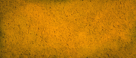 Distressed stone wall grunge texture abstract yellow color background