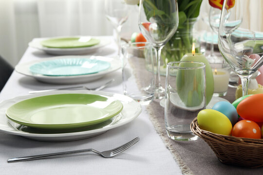 Easter celebration. Festive table setting with painted eggs