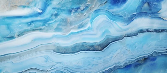 Foto op Canvas A detailed view of a vibrant blue and white marble pattern resembling the fluidity of water waves in the ocean, creating an electric blue and calming effect © AkuAku