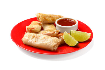 Tasty fried spring rolls, lime and sauce isolated on white