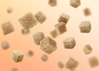 Brown cane sugar cubes falling on peach color gradient background