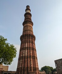 Fototapeta na wymiar Daytime Picture of the famous historical place of Delhi - Qutub Minar