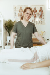 therapist woman in massage cabinet conducting examination